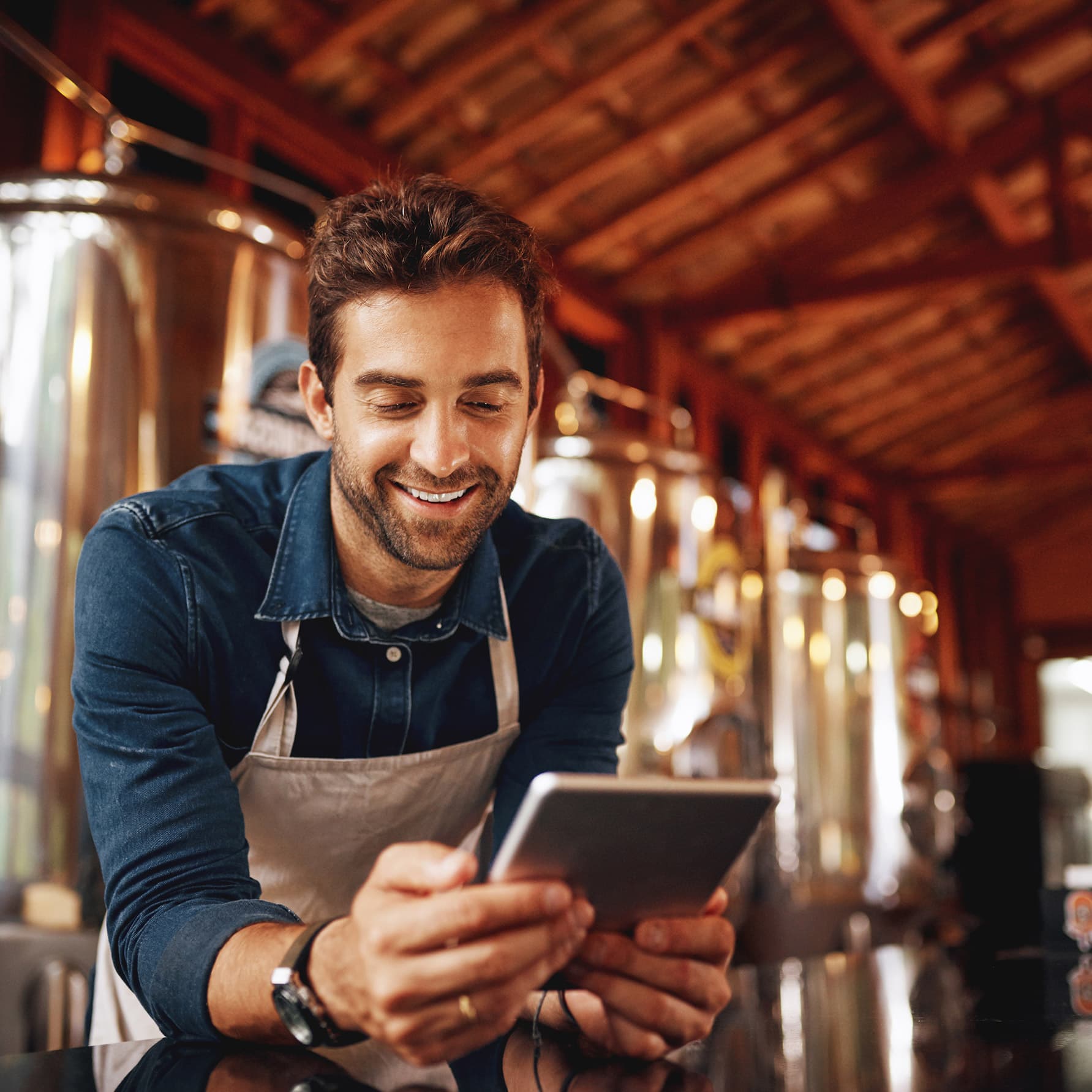 Brewery owner looking at a tablet