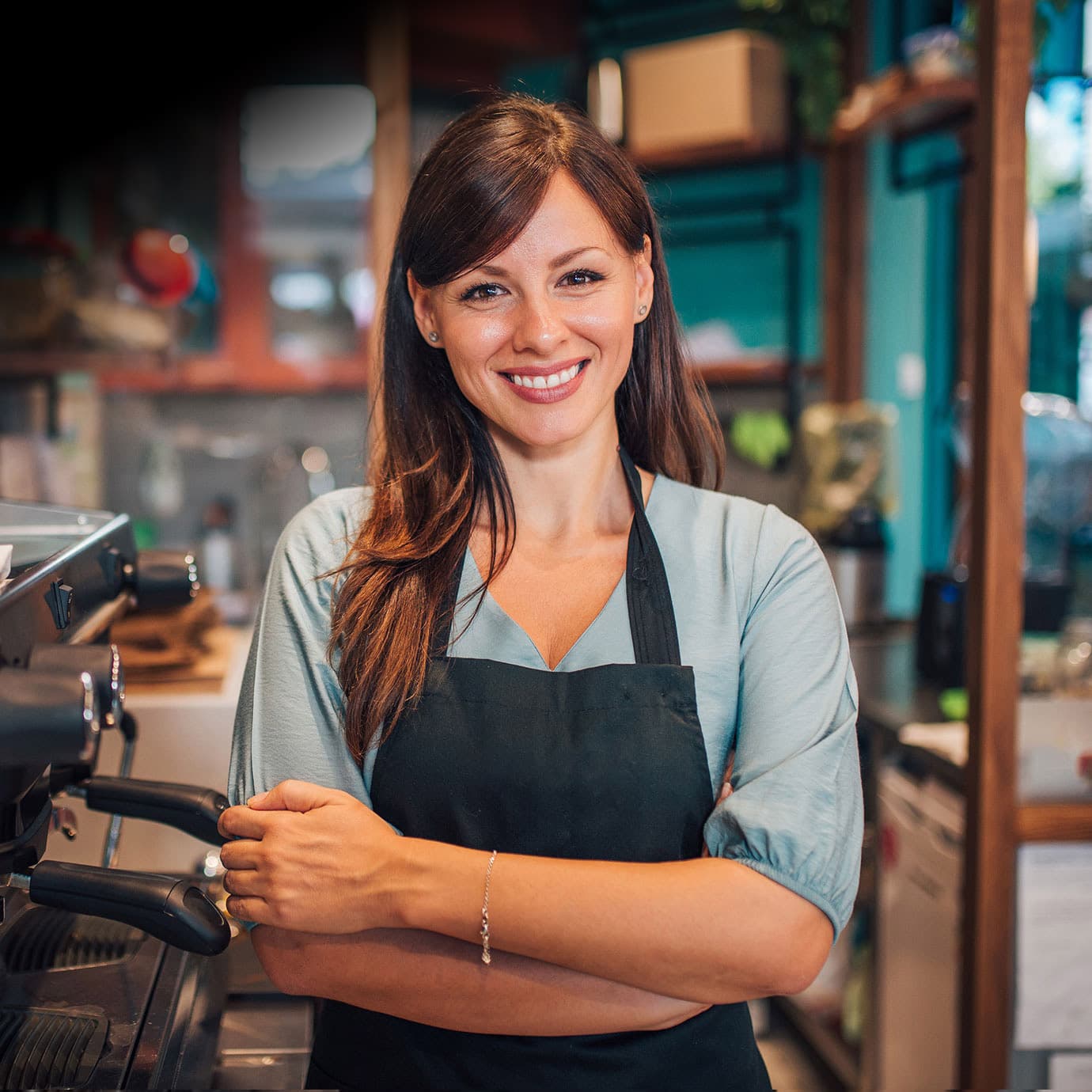 Shop owner smiling at camera