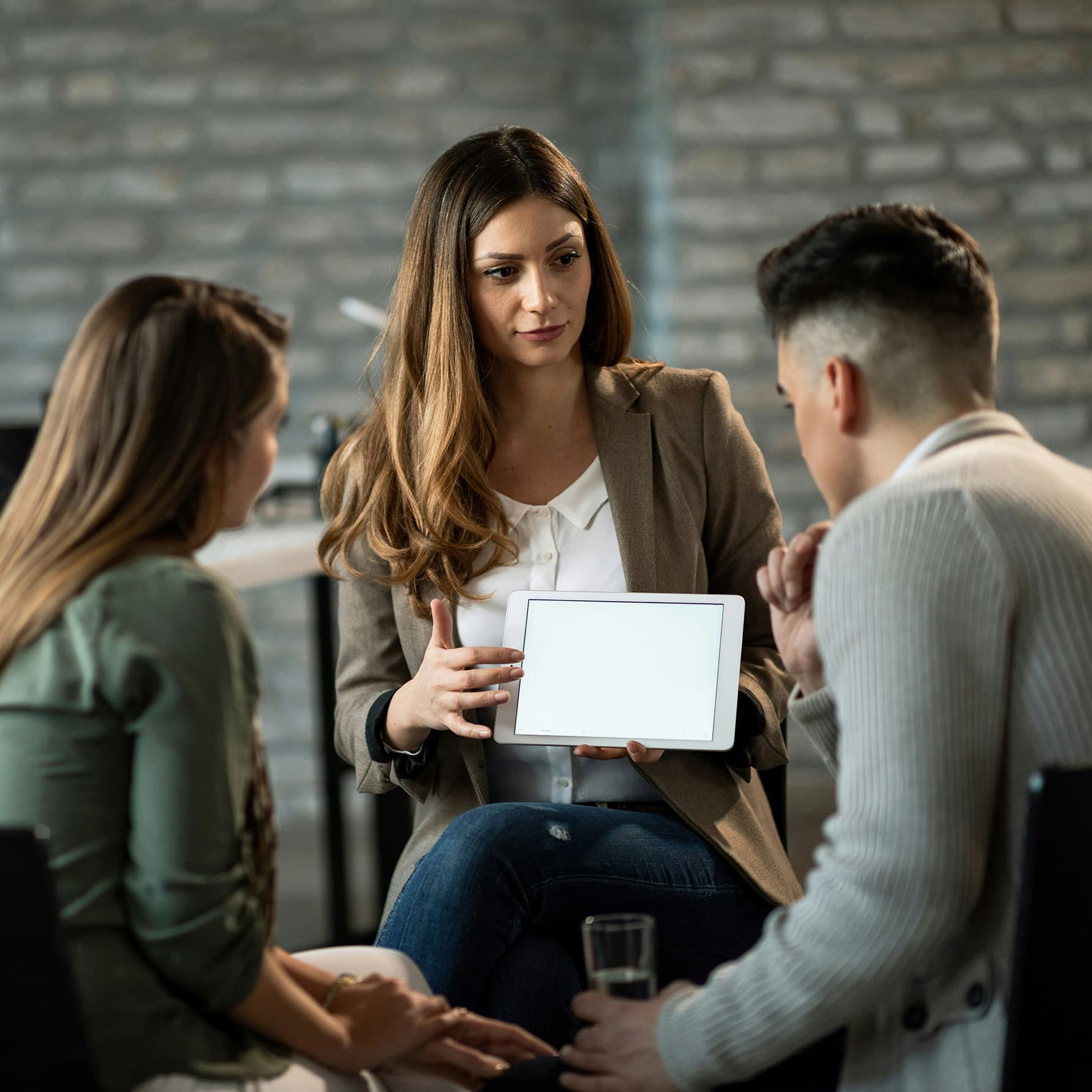 People meeting and using a tablet