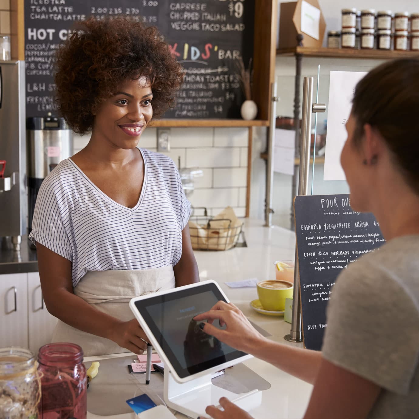 Person paying using a point of sale card