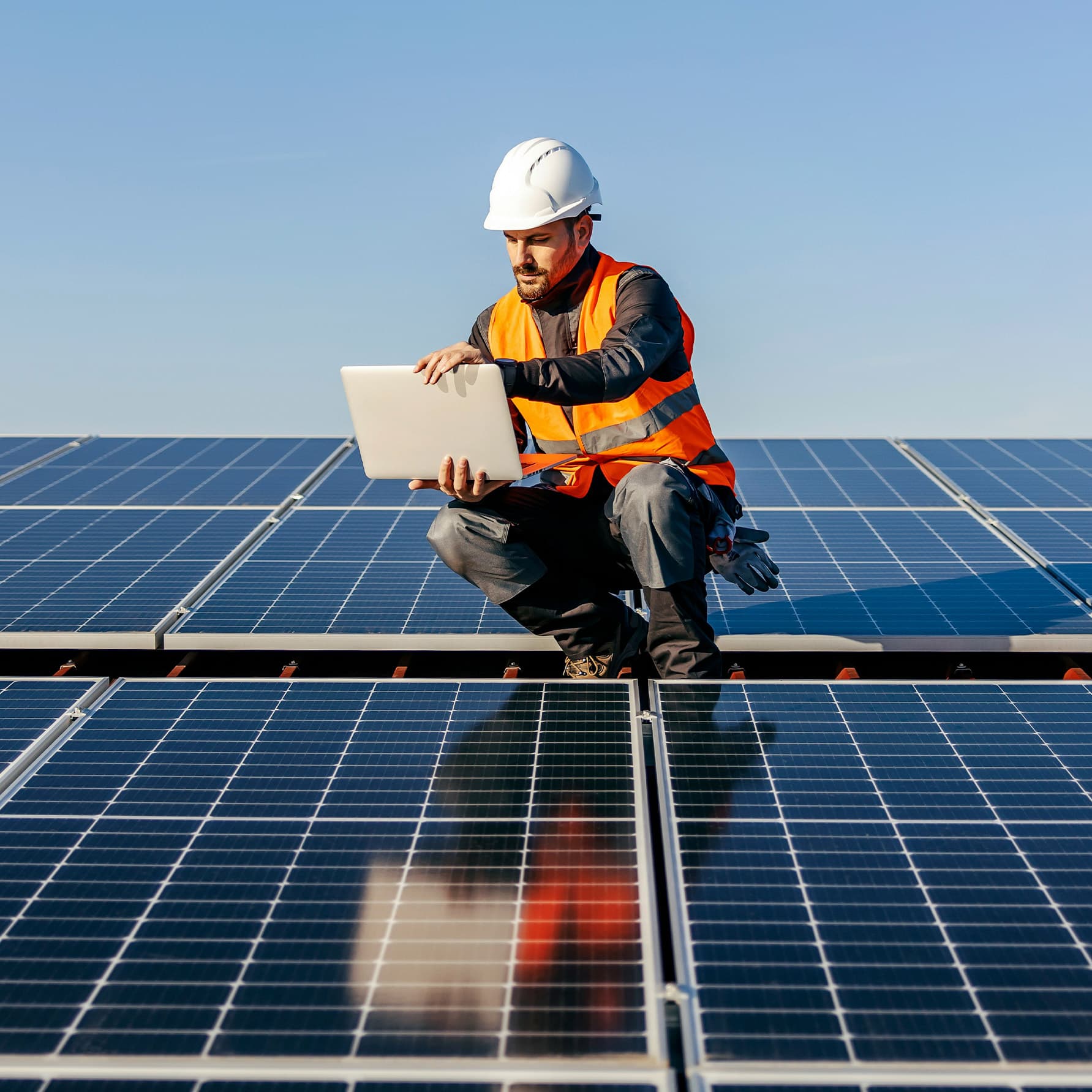 An engineer inspecting a solar roof