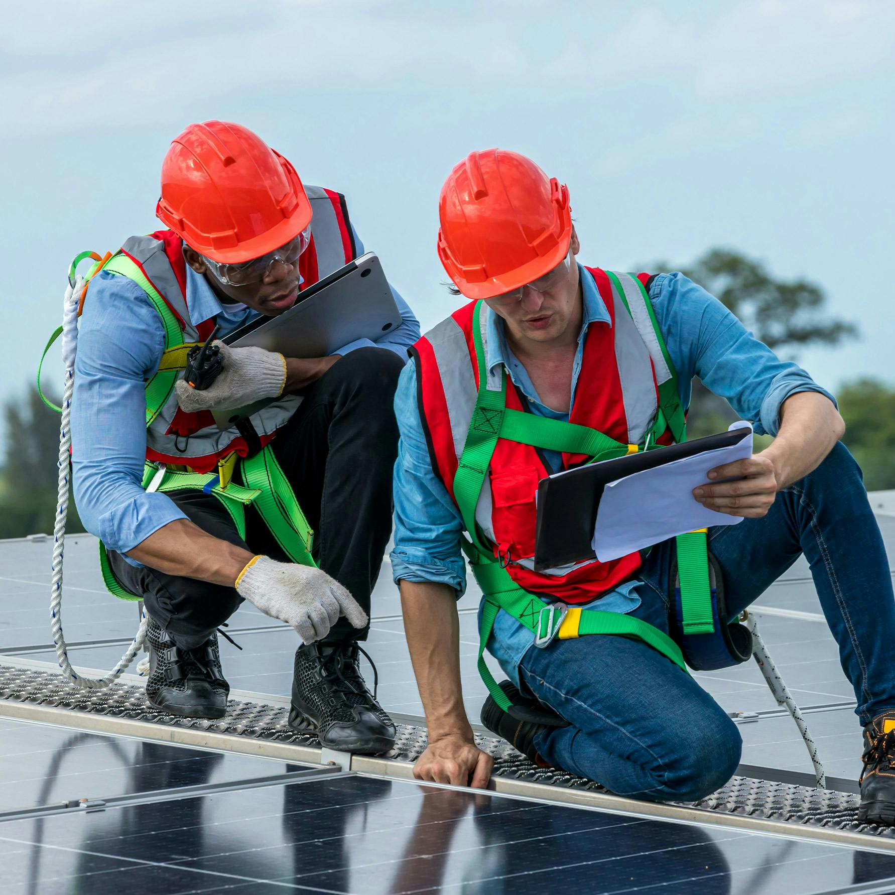 People inspecting and installer solar panels