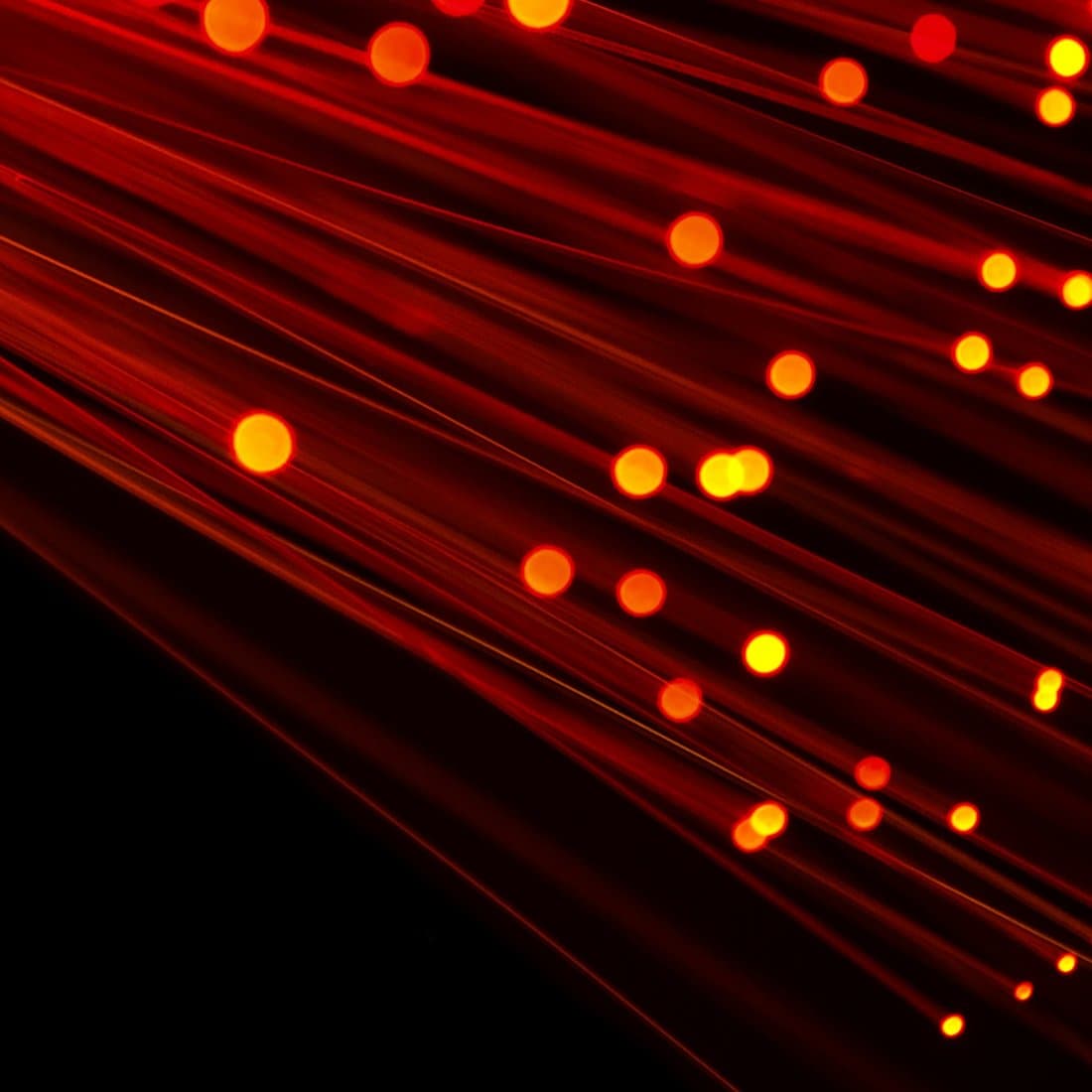 Red fibre optic cables carrying light